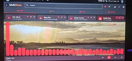 MultiWave on a car head unit, Radio tab playing Radio Van in the red theme