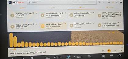 MultiWave on a car head unit, Local tab in light mode with an amber theme